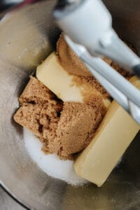 Mixing bowl with butter, brown sugar, white sugar and ground espresso.