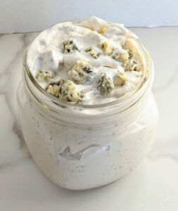 The BEST homemade Blue Cheese Dressing and Dip. A secret ingredient sets it apart from the rest and takes this blue cheese dressing to a whole other level! Perfect for dipping chips, fries, or on top of salad.