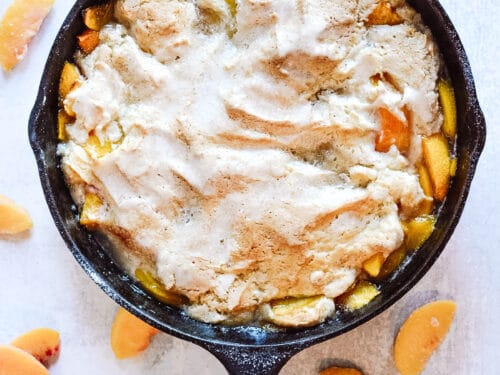 Cast iron skillet peach cobbler. In 12 inch cast iron skillet melt 1 stick  butter, add 4 - 15 oz cans peaches with s…